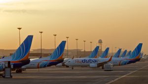 A flydubai Boeing 737-800 pushes back off gate at Dubai International Airport