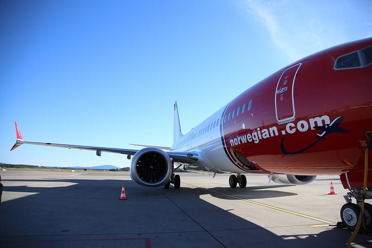 Close-up of a Norwegian Boeing 737 at the terminal.