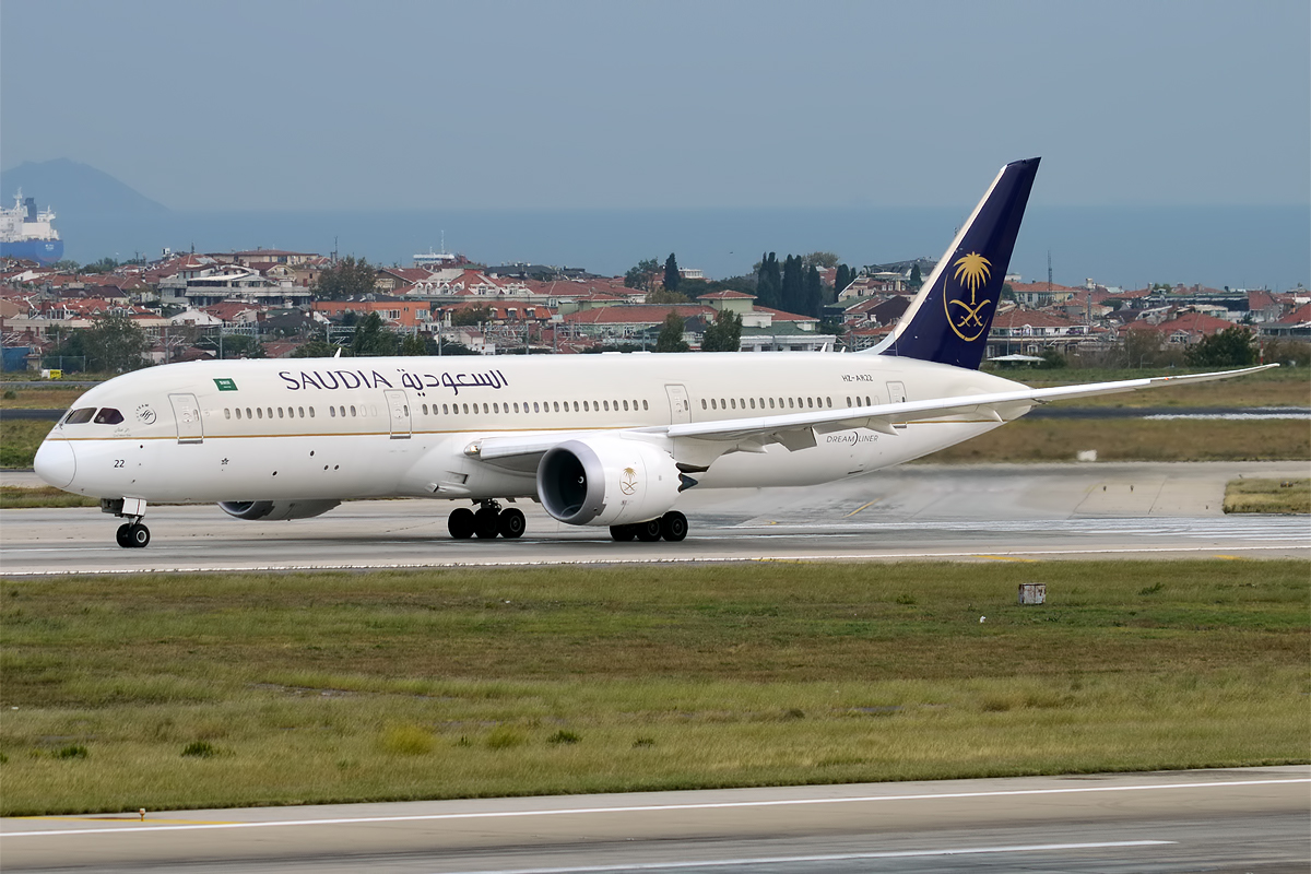 A SAUDIA Boeing 787 lines up on the runway.