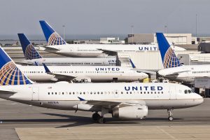 A series of United Airlines aircraft parked at San Francisco terminal