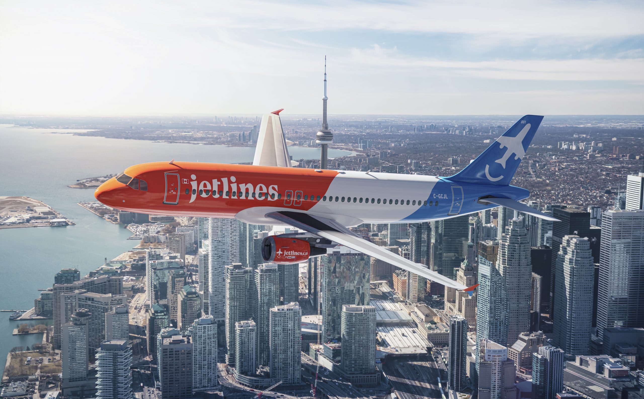 A Canada Jetlines Airbus A320 over the city syline.