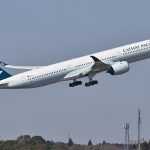 A Cathay Pacific Airbus A350 climbing after takeoff.