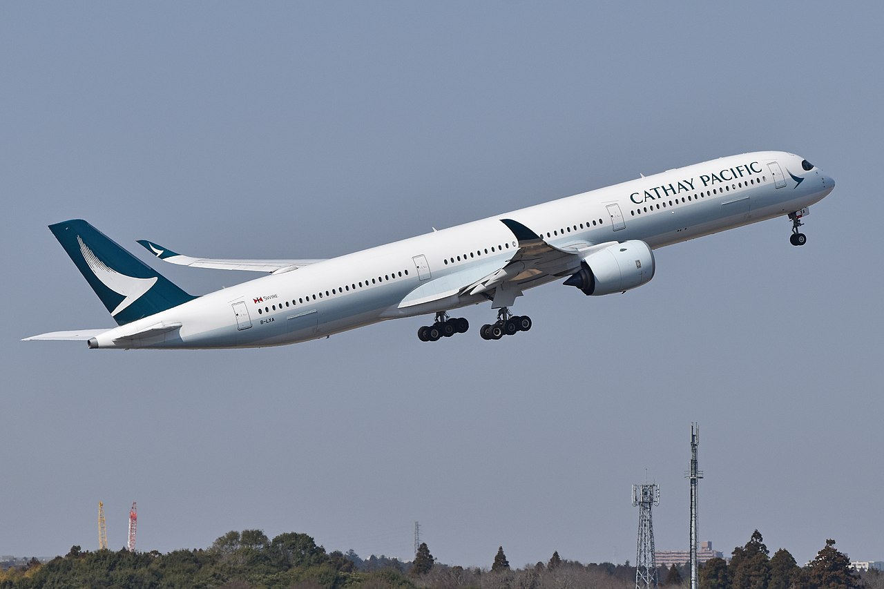 A Cathay Pacific Airbus A350 climbing after takeoff.