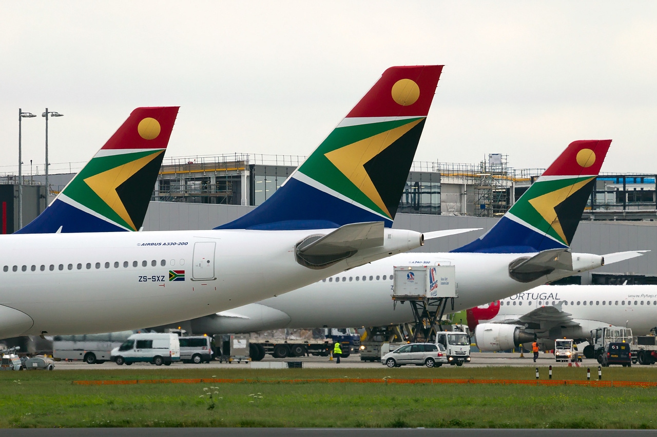The tails of three South African Airways aircraft.