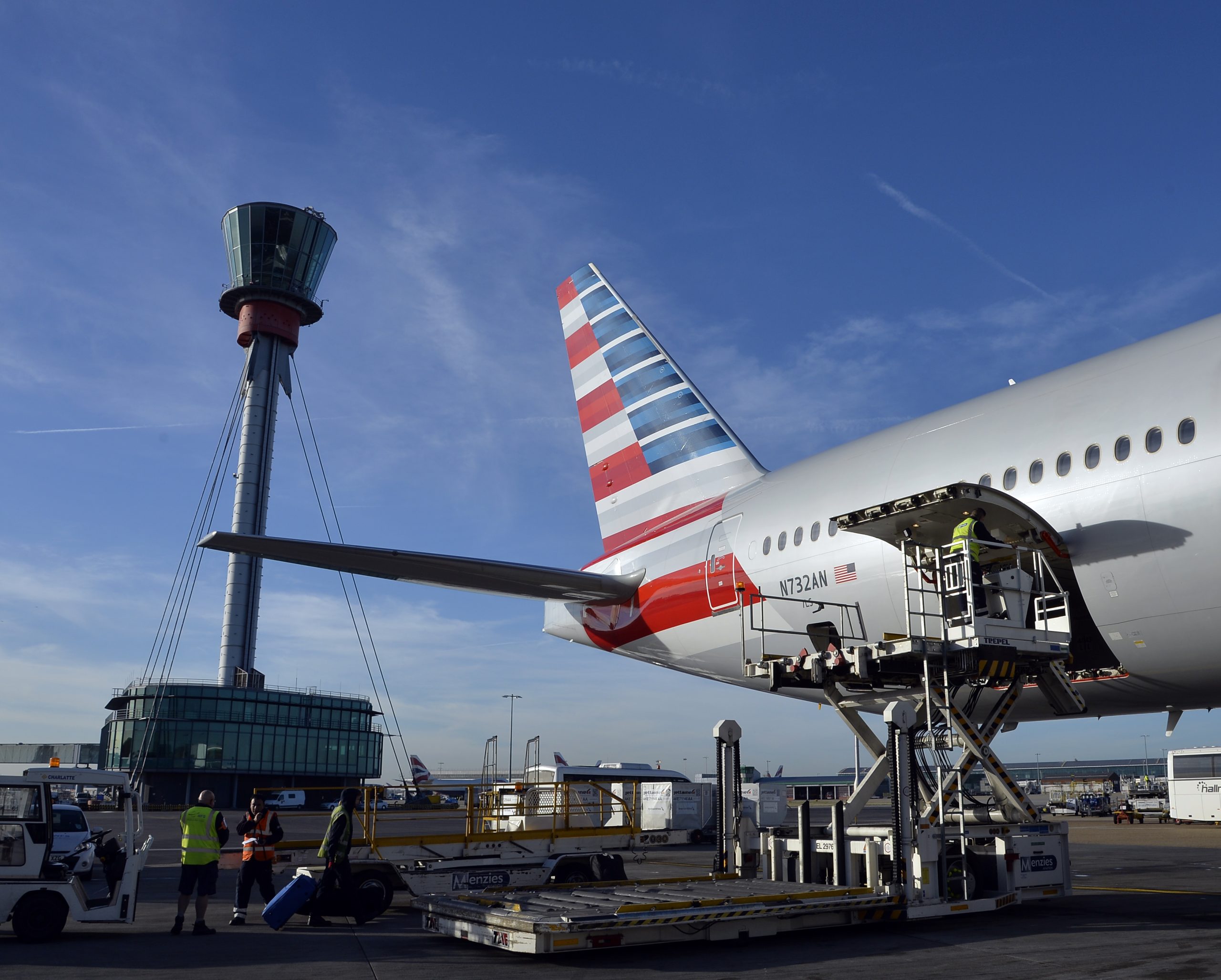 Photo: American Airliens ground staff load an American Airlines flight at Heathrow. Photo Credit: Heathrow Airport
