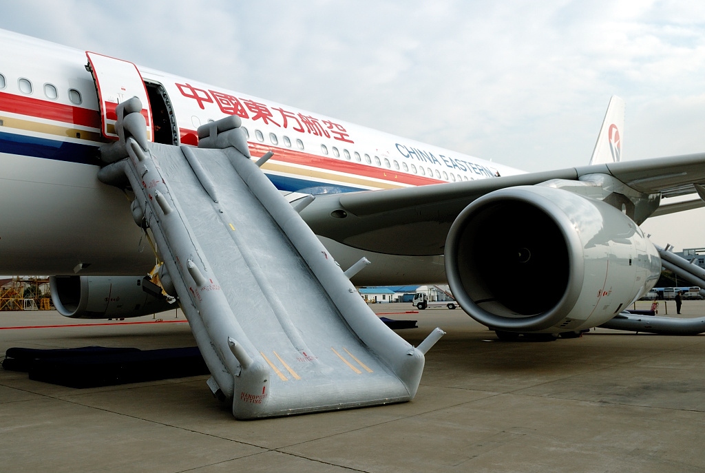 An Airbus aircraft with air safety passenger slide deployed.