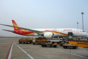 A Hainan Airlines aircraft being loaded with cargo