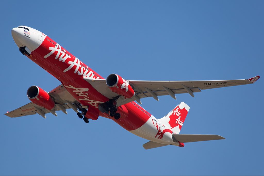 An AirAsia X aircraft climbing steeply after takeoff