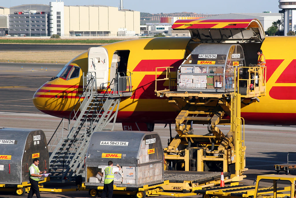 A DHL freighter aircraft loading air cargo