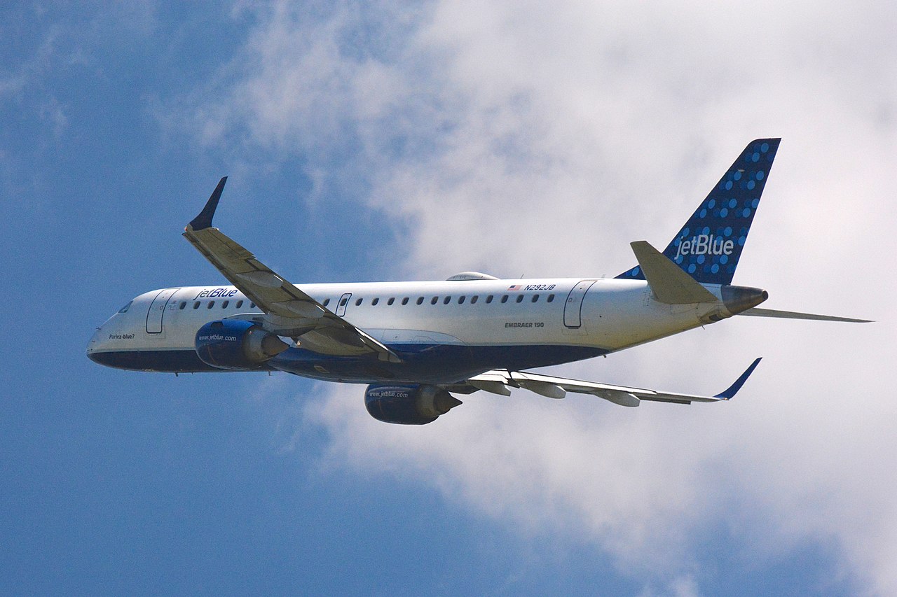 A JetBlue Embraer aircraft in flight.