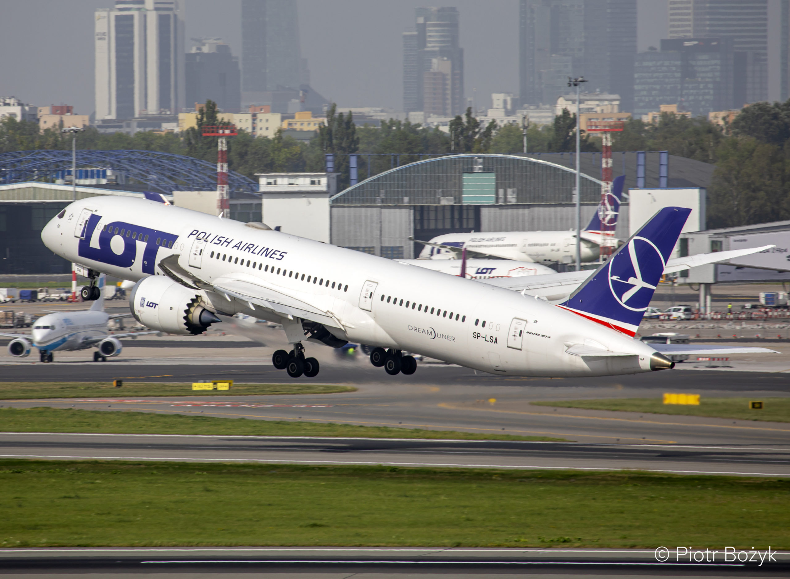 A LOT Polish Airlines flight taking off.