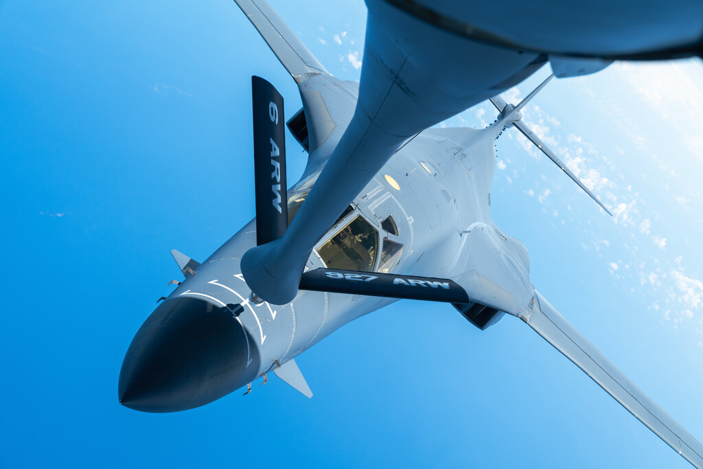 A US Air Force B-1B Lancer aircraft receives mid-air refuelling from a tanker over the Caribbean.