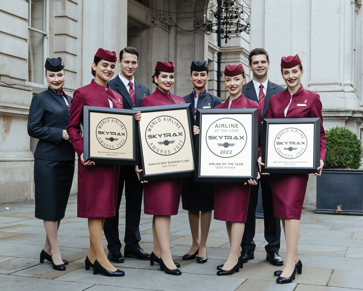 Qatar Airways staff show off their Skytrax 2022 awards