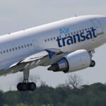 An Air Transat Airbus taking off at Manchester airport.