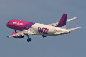 A Wizz Air Airbus banking gently after takeoff.