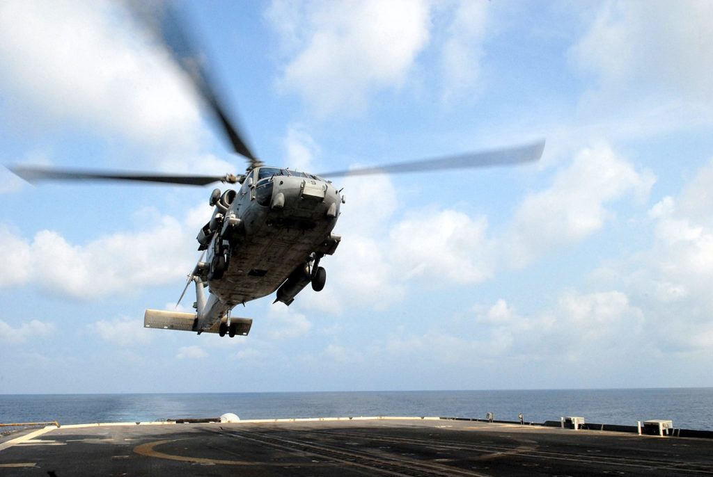 A US Navy Seahawk helicopter landing on USS Chancellorsville.