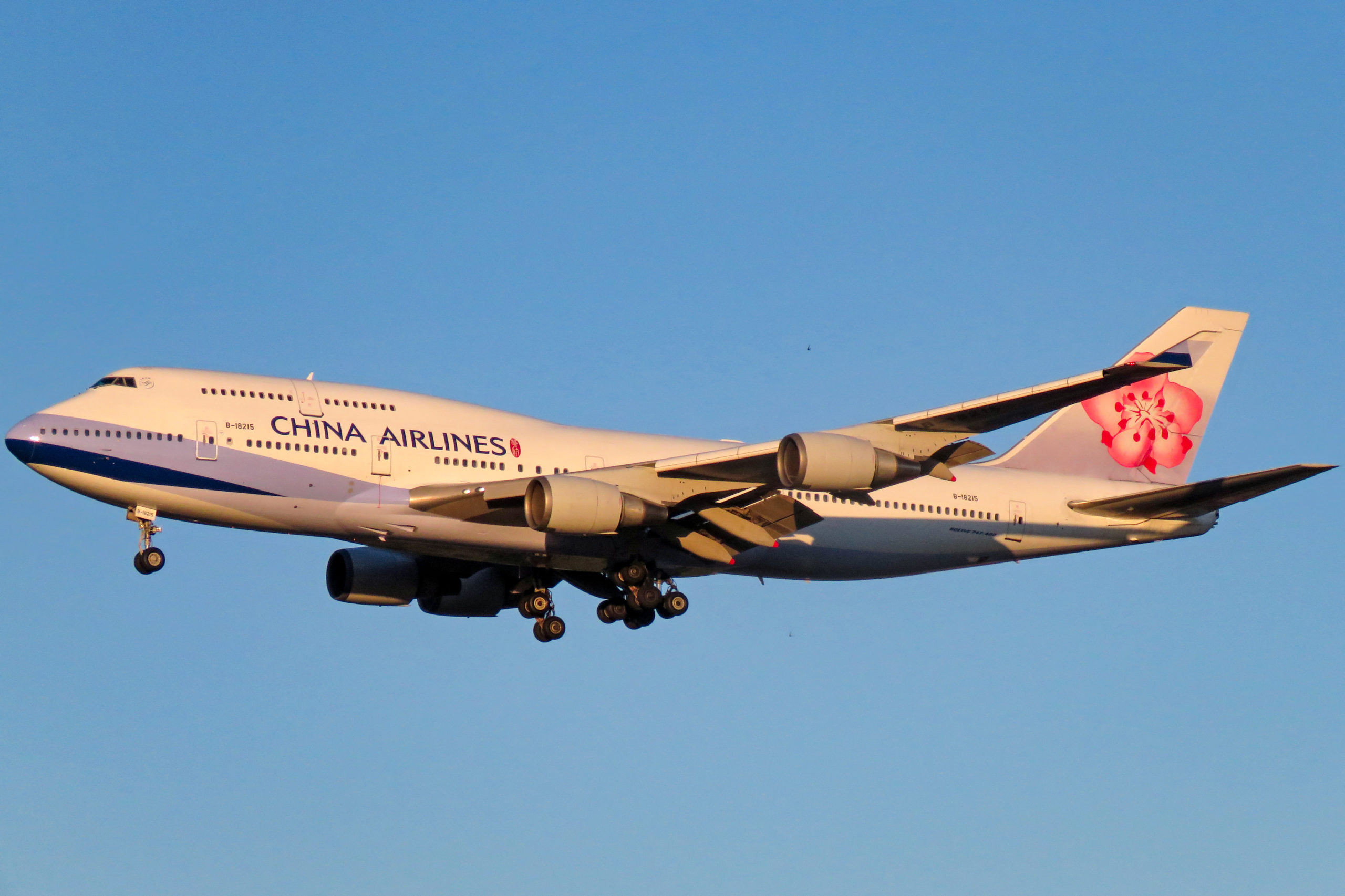 A China Airlines B747 with landing gear down.