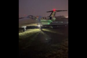 Afrojack Cessna Citation on the grass at Antwerp Airport