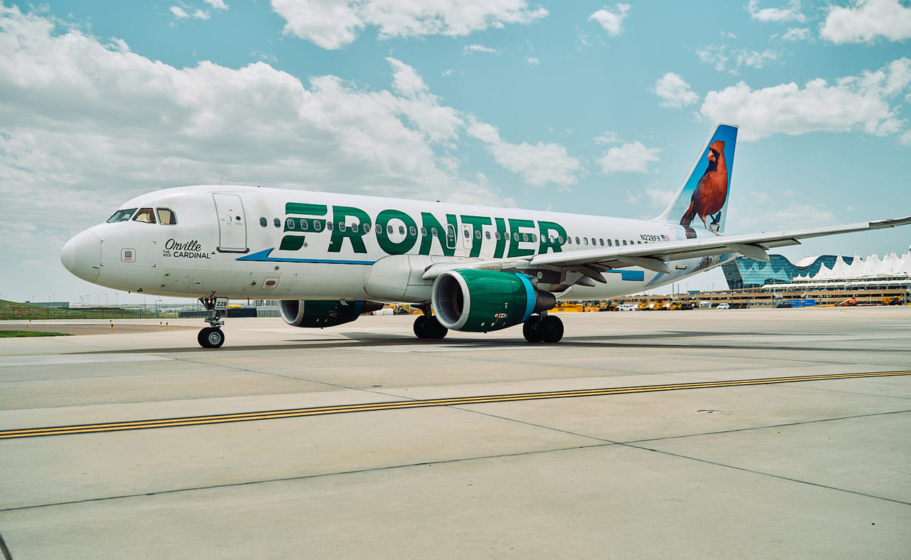 A Frontier Airlines Airbus parked on the tarmac.
