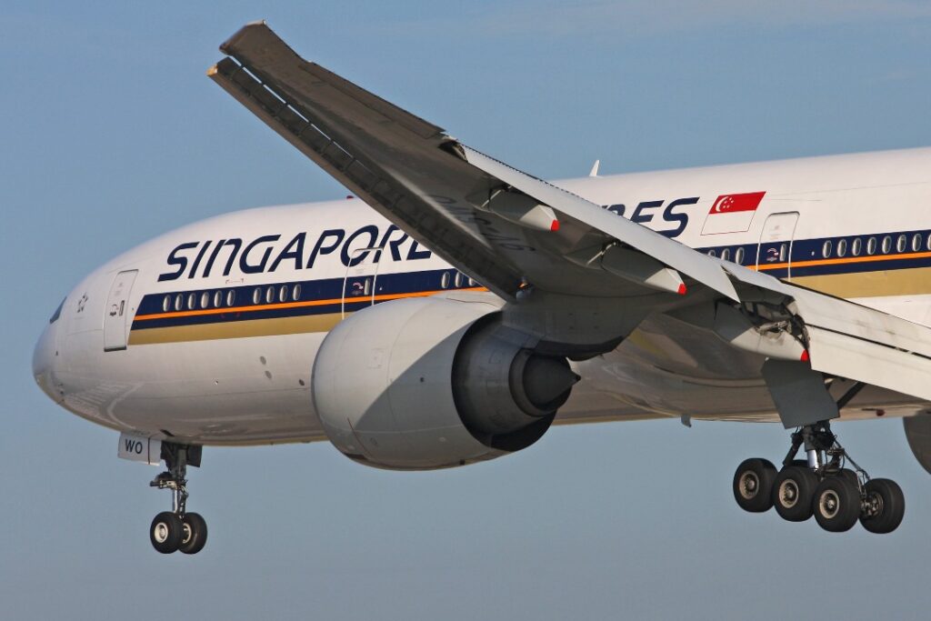 A Singapore Airlines Boeing 777 with wheels down.