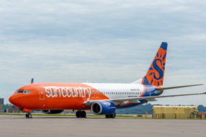 A Sun Country Airlines Boeing 737NG aircraft parked.