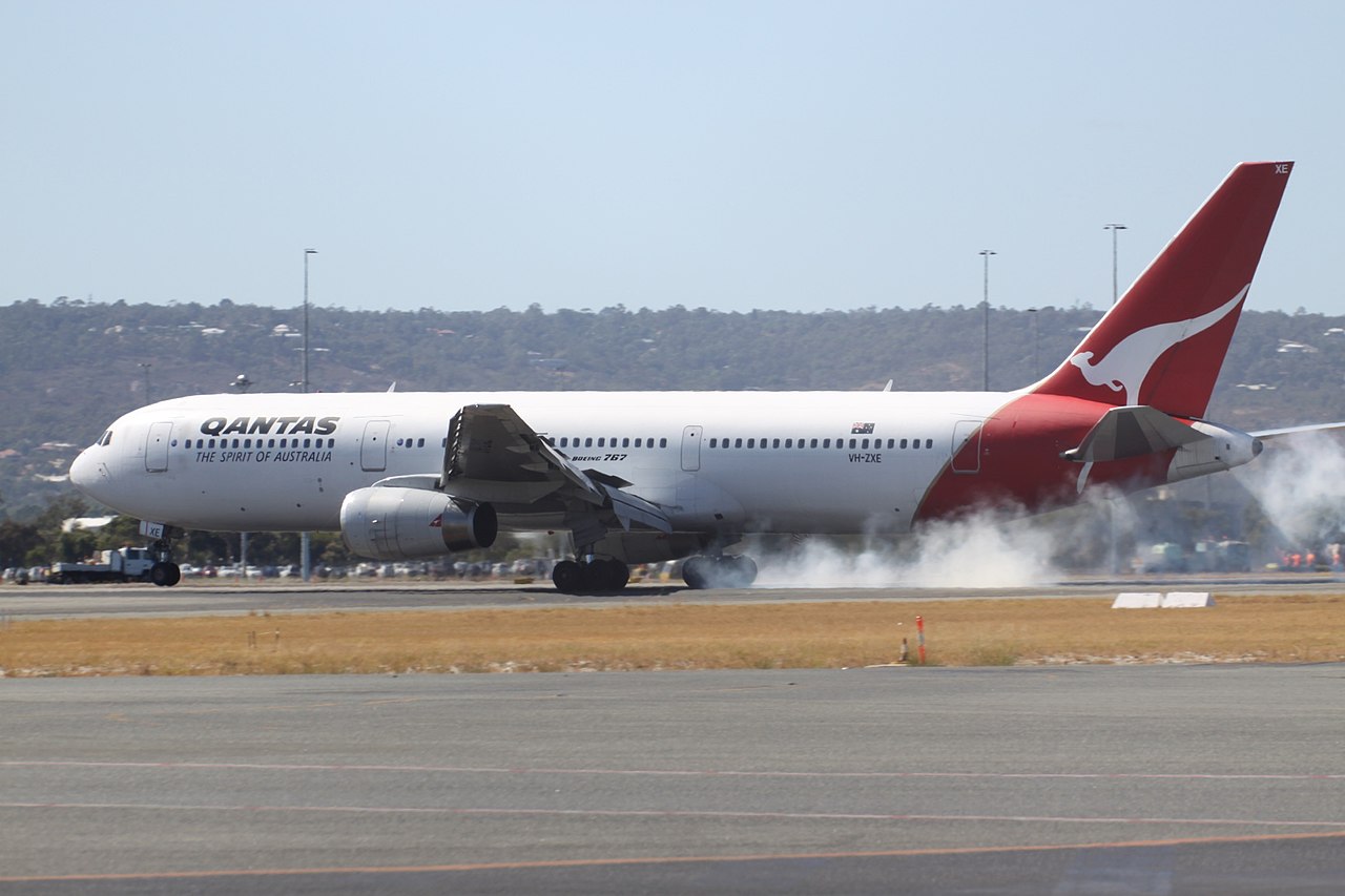 A Qantas Boeing touching down heavily.