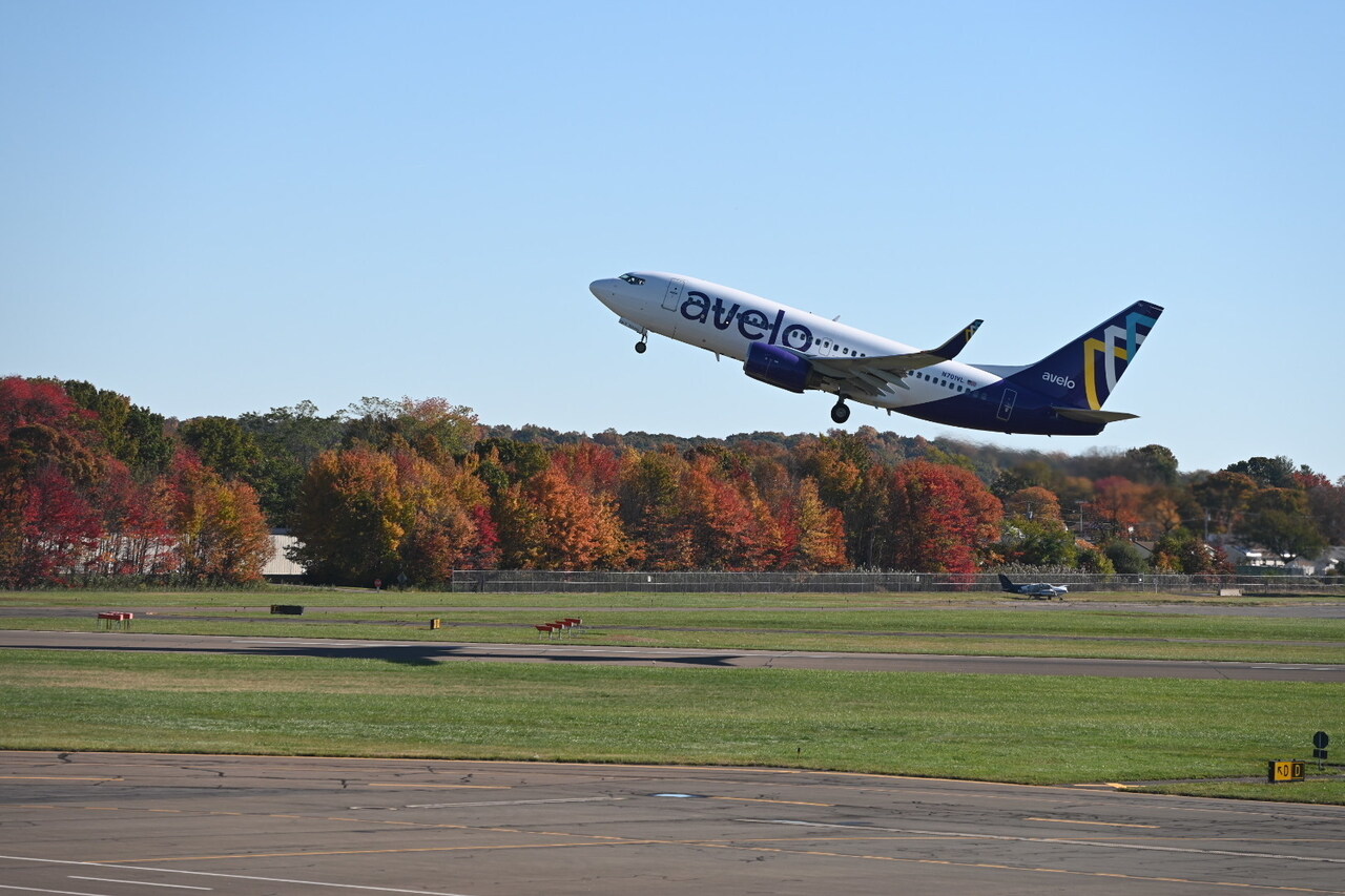 An Avelo Airlines jet climbs out after take off.