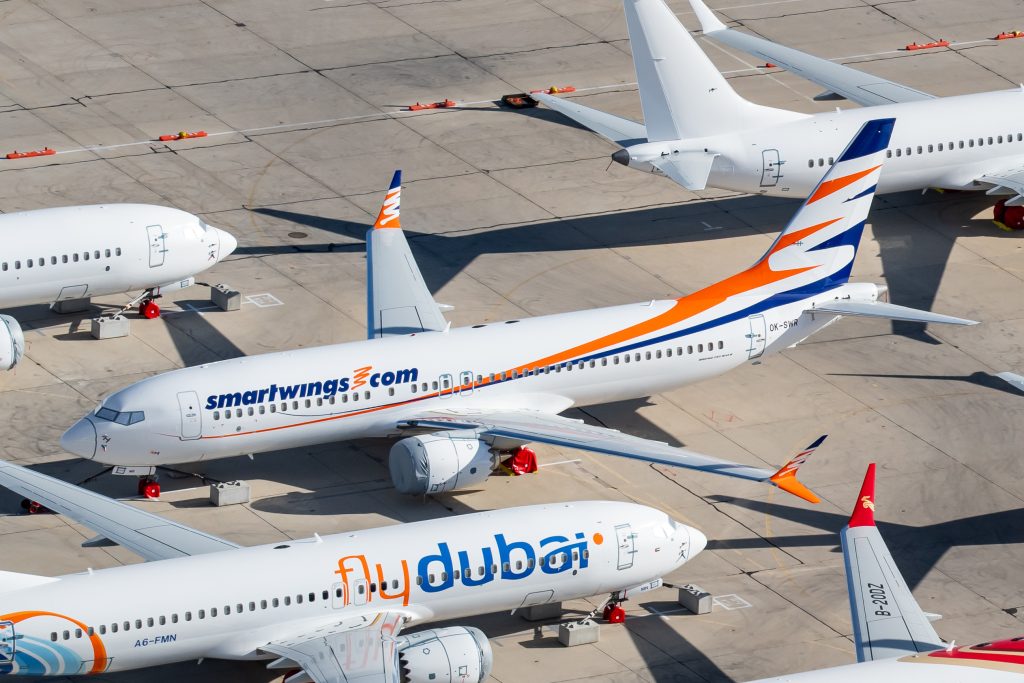 A group of leased 737 aircraft painted in FlyDubai airline colours.