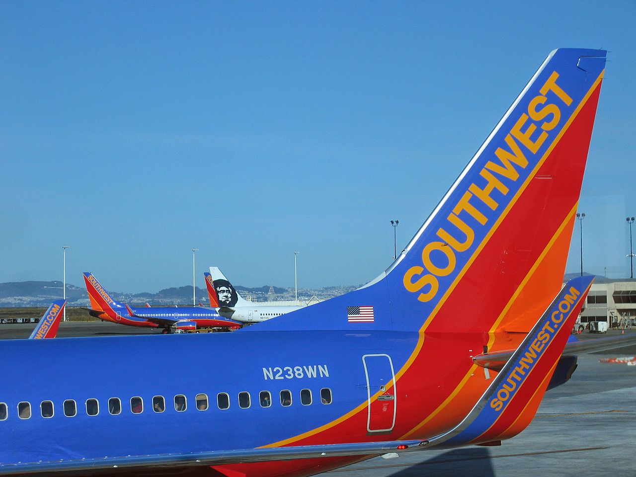 The tailplane of a parked Southwest Airlines plane.