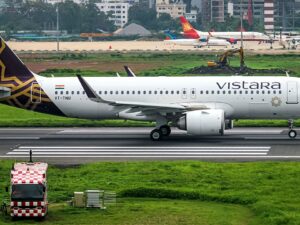 A Vistara Airbus lined up on the runway for takeoff.