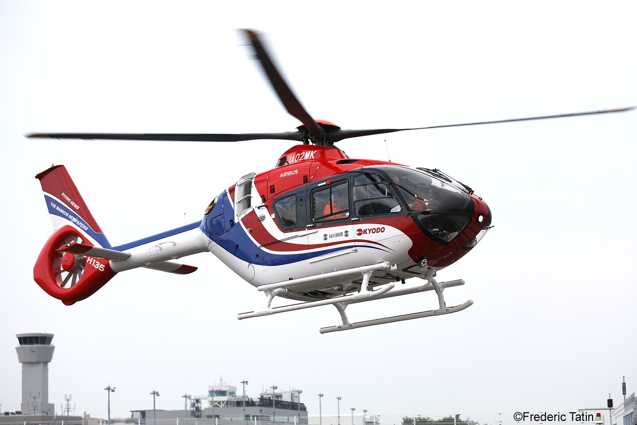 The new Mainichi Newspapers Airbus H135 helicopter in flight.
