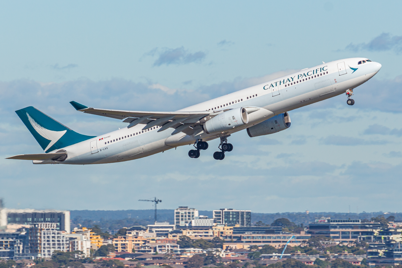 A Cathay Pacific Airbus climbs out after takeoff.