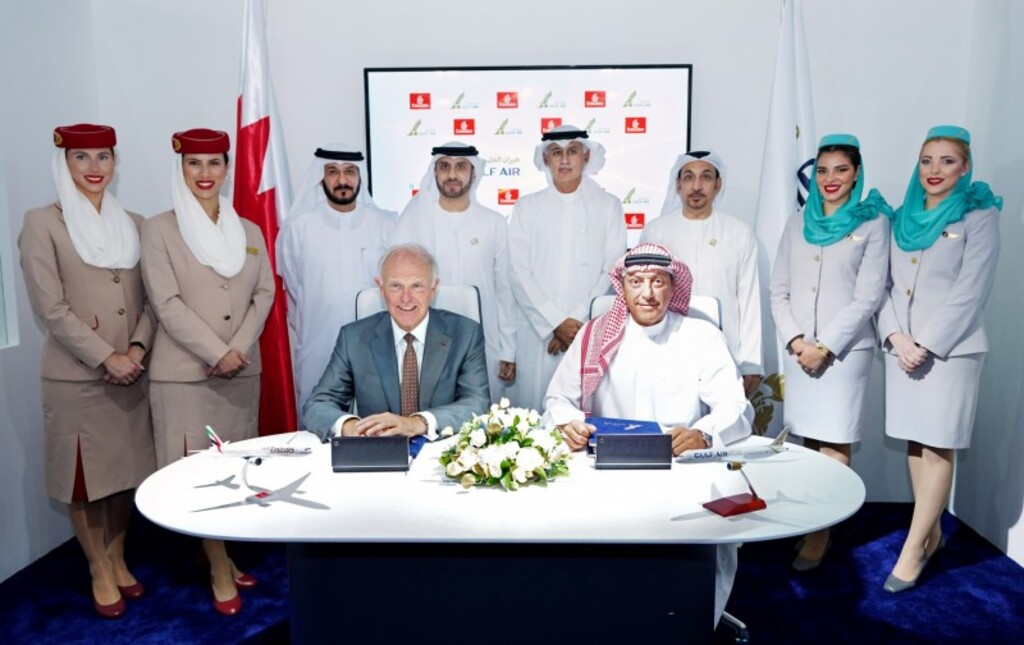 Gulf Air and Emirates representatives sign codeshare agreement.