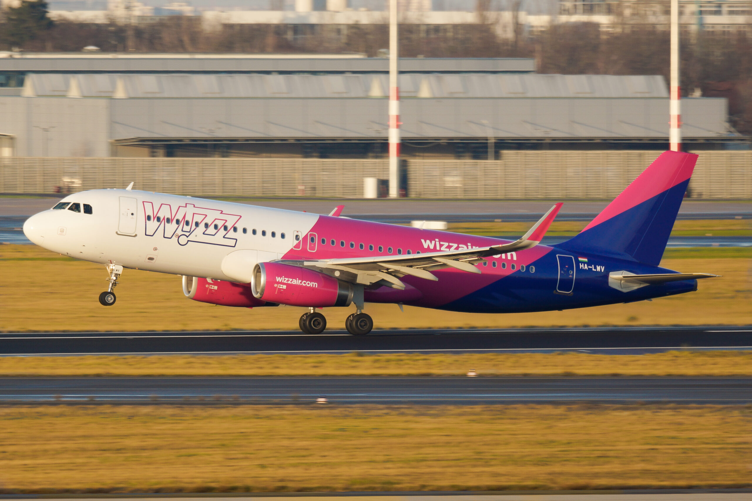 A Wizz Air Airbus lifts off the runway.