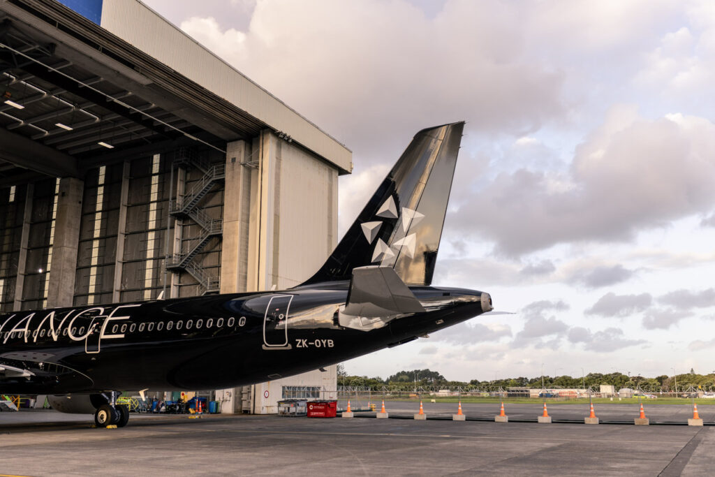 The new 'all black' livery Air New Zealand A321neo on the hangar at Auckland Airport.