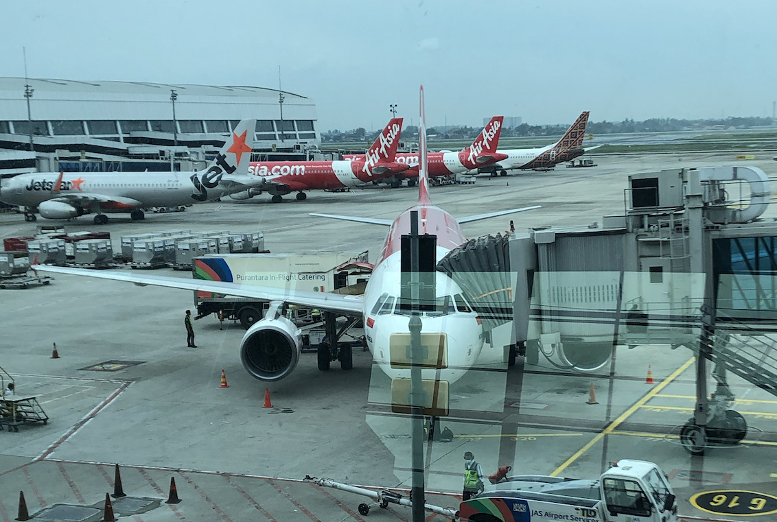 AirAsia Indonesia Airbus parked at Jakarta terminal.