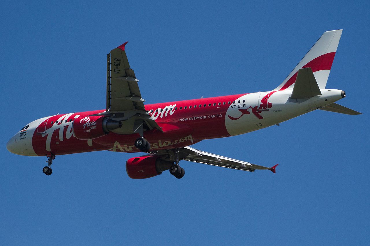 An AirAsia India Airbus passes overhead.