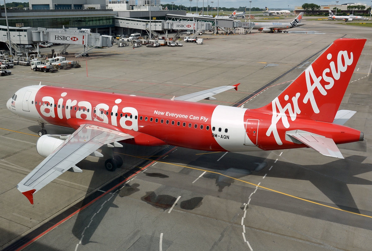 An AirAsia Airbus parked on the tarmac.