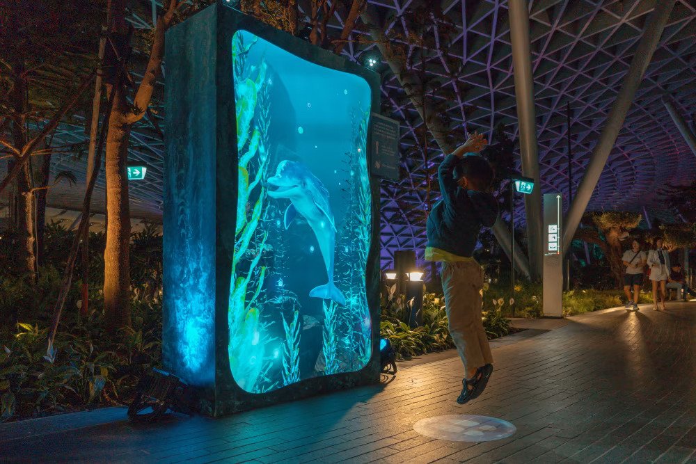 Changi Festive Village stunning £D marine dolphin display at Singapore Changi Airport.
