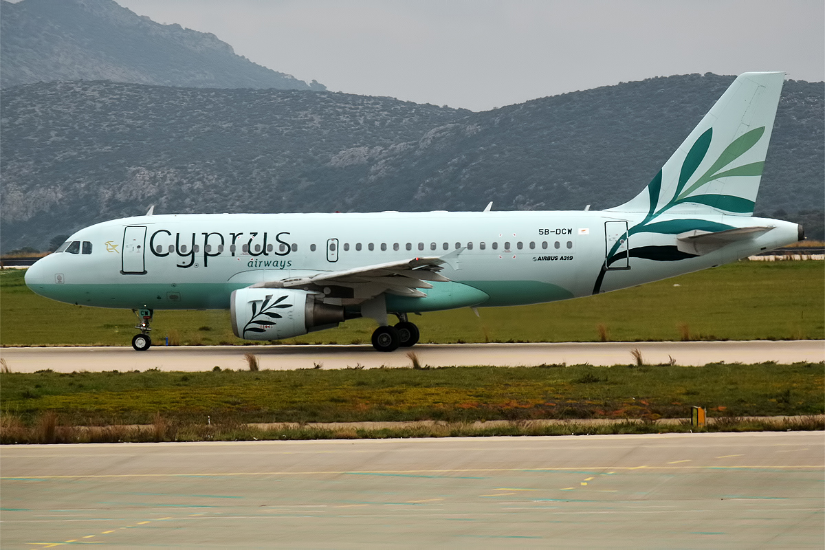 A Cyprus Airways Airbus A319 lines up on the runway.