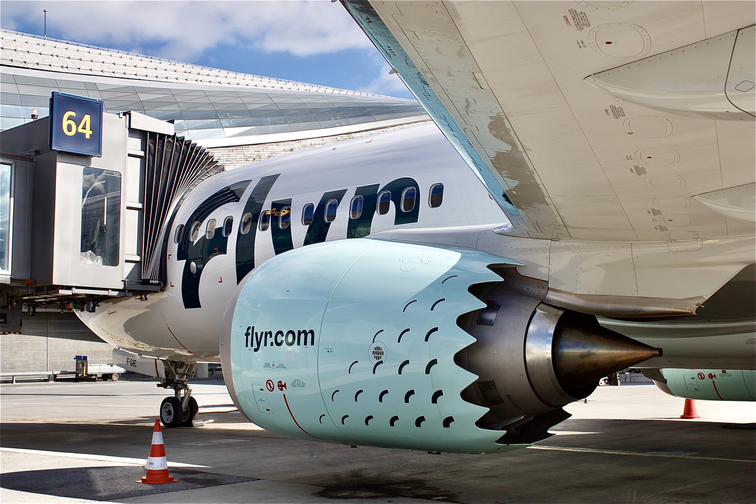 Close-up of a Flyr aircraft at the terminal.