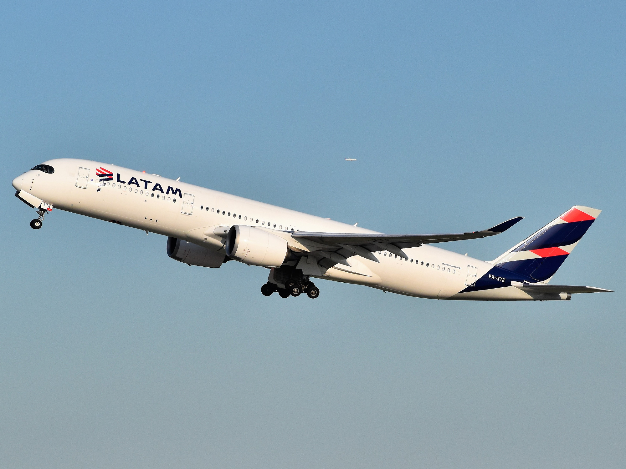 A LATAM Airlines A350 climbs after takeoff.
