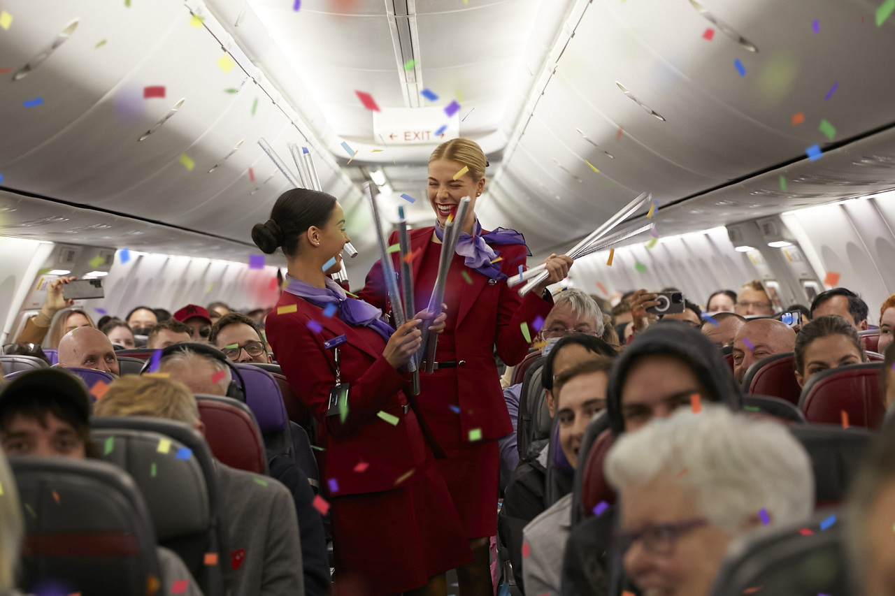 Virgin Australia cabin crew celebrate the new marketing campaign in a crowded cabin.