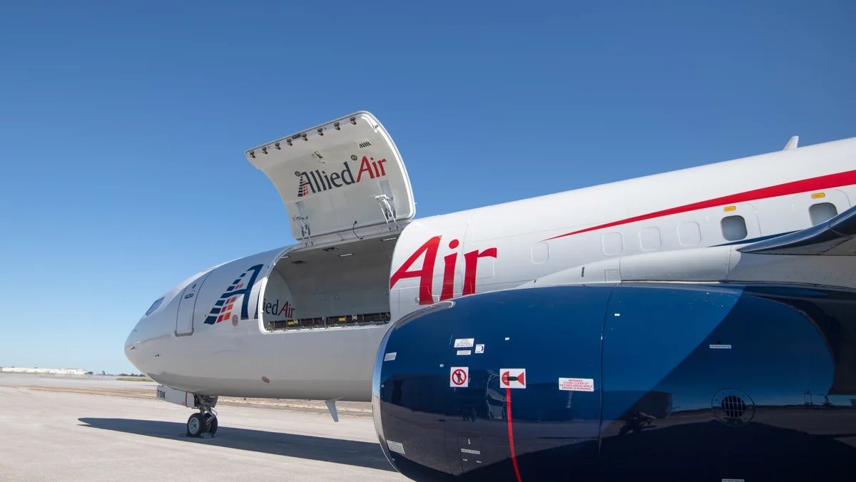 The AEI Boeing 737 freighter conversion with side fuselage loading door open.