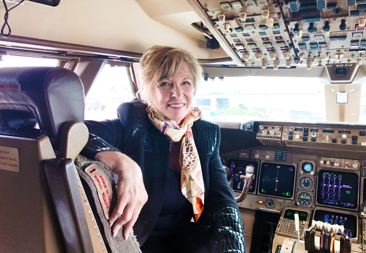 Beti Ward founder of Pacific Air Cargo it the pilot's seat of a freighter aircraft.
