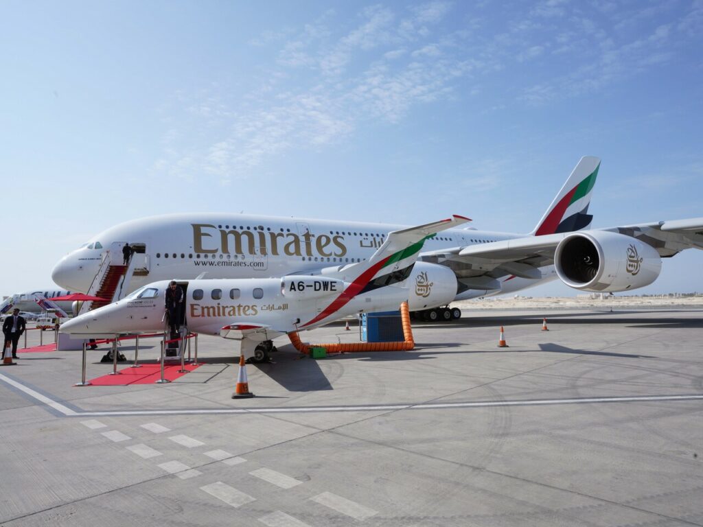 Two Emirates aircraft - an A380 and an Embraer Phenom parked together at the Bahrain Airshow.