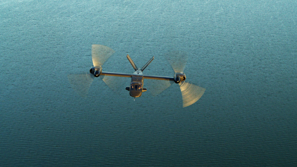 The Bell Textron V-280 flying over water.