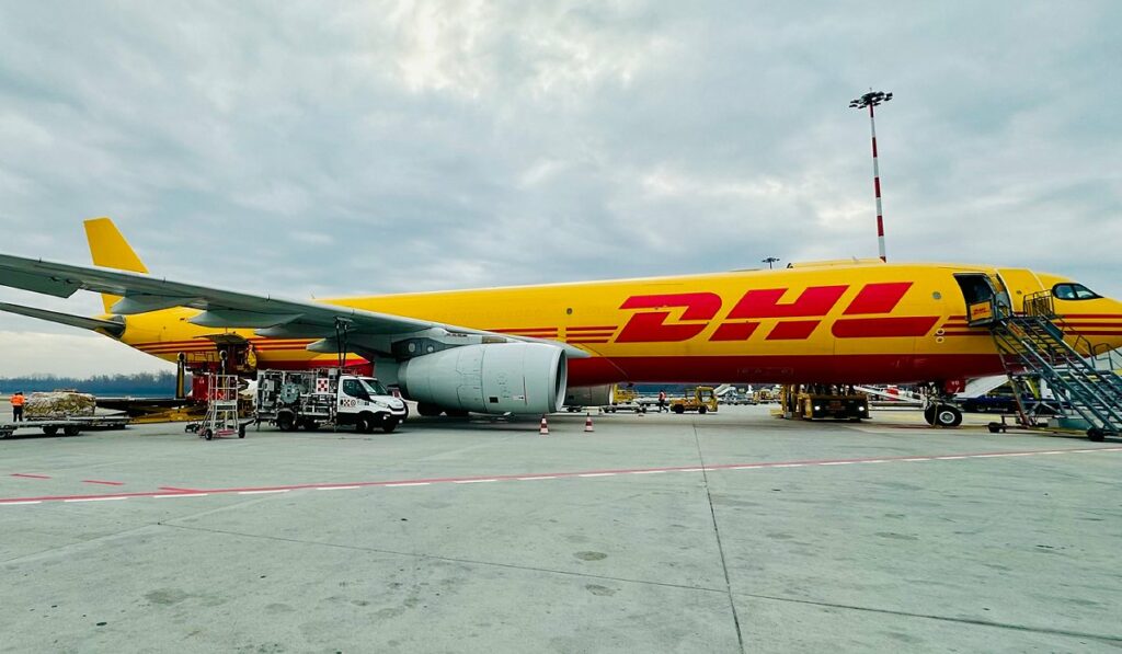 A DHL Express Italy air cargo freighter aircraft on the ramp.