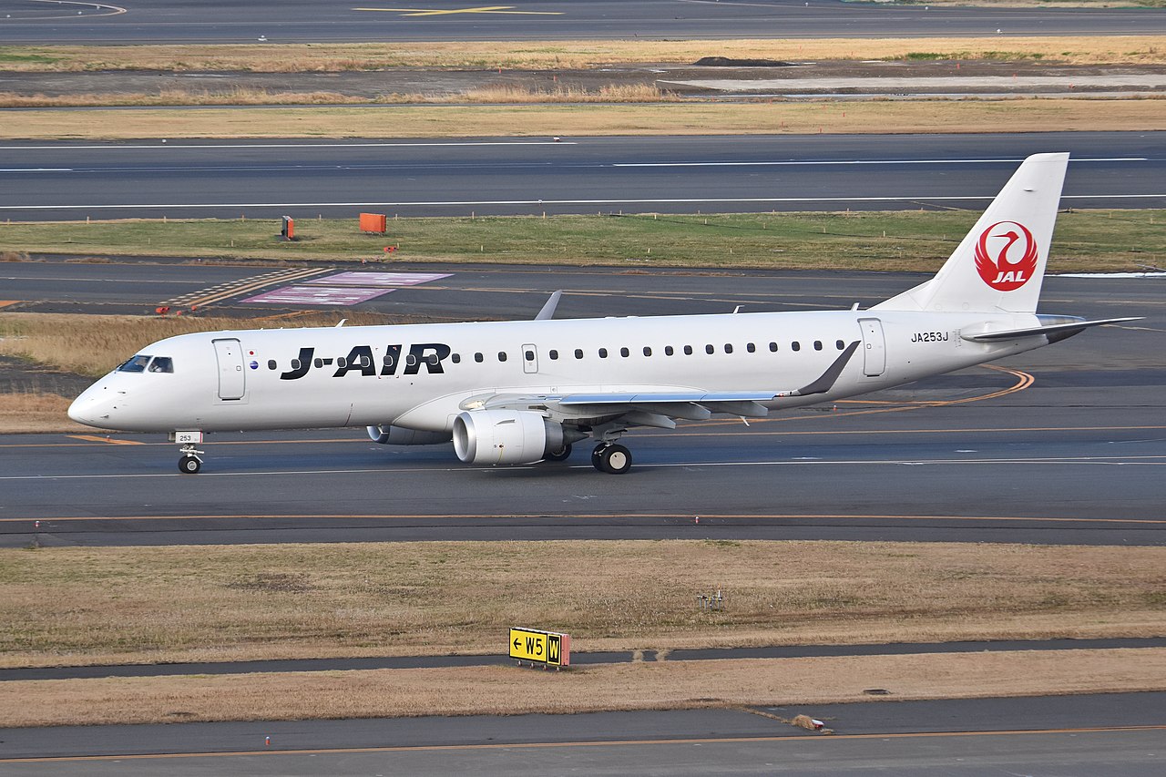 A Japan Airlines J-AIR Embraer E190 taxiing.