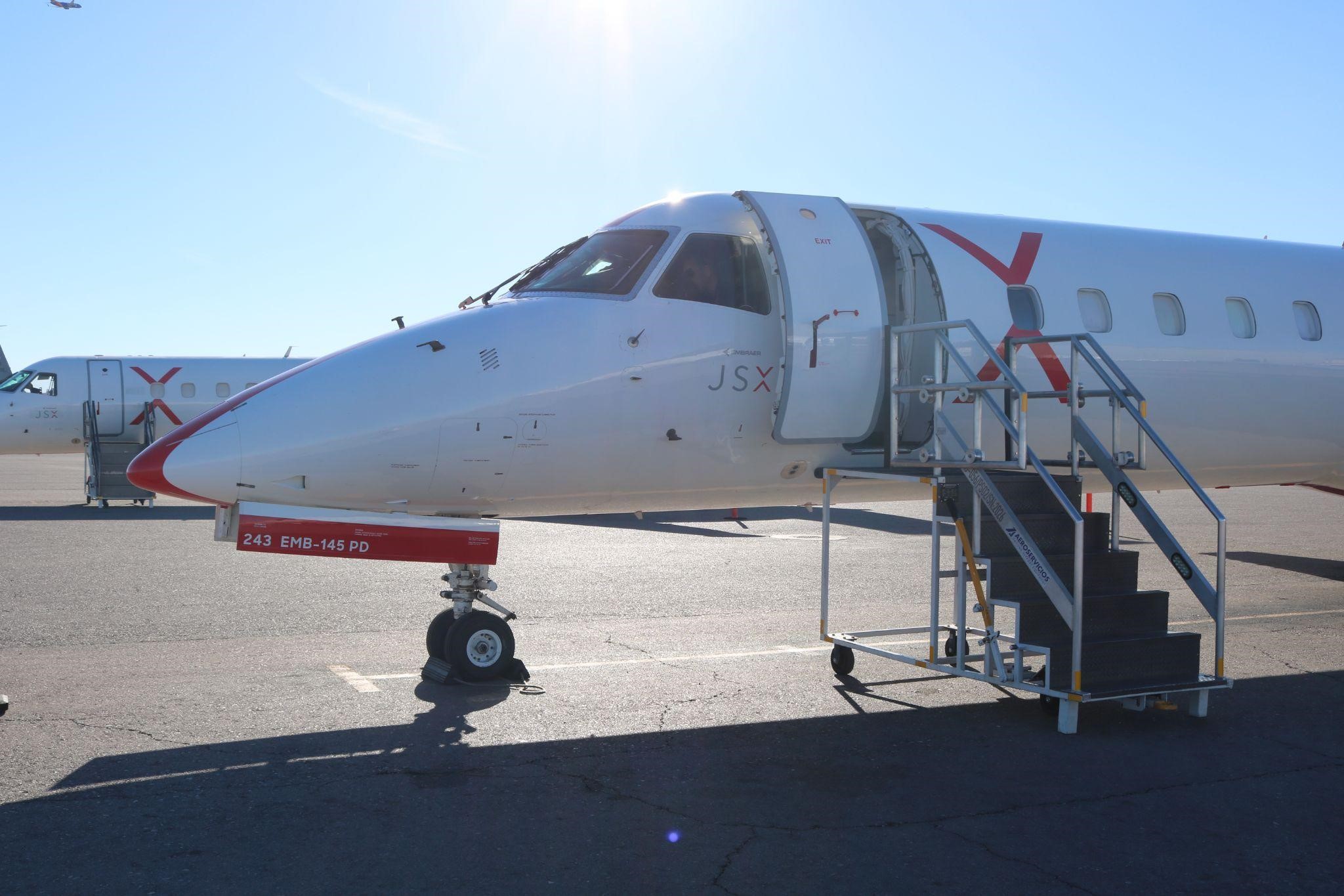 A JSX Embraer ERJ-145 parked on the tarmac ready for boarding.